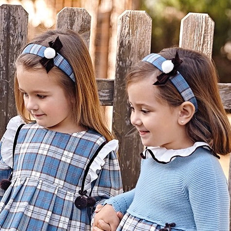 Blue checked headband with pom pom