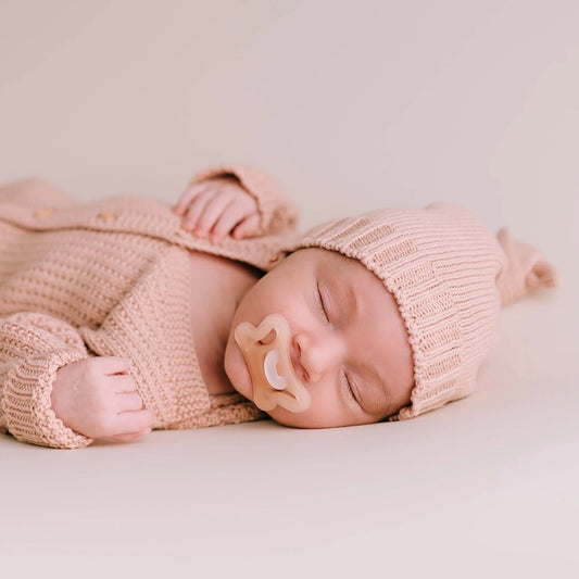 Pink knitted knot hat
