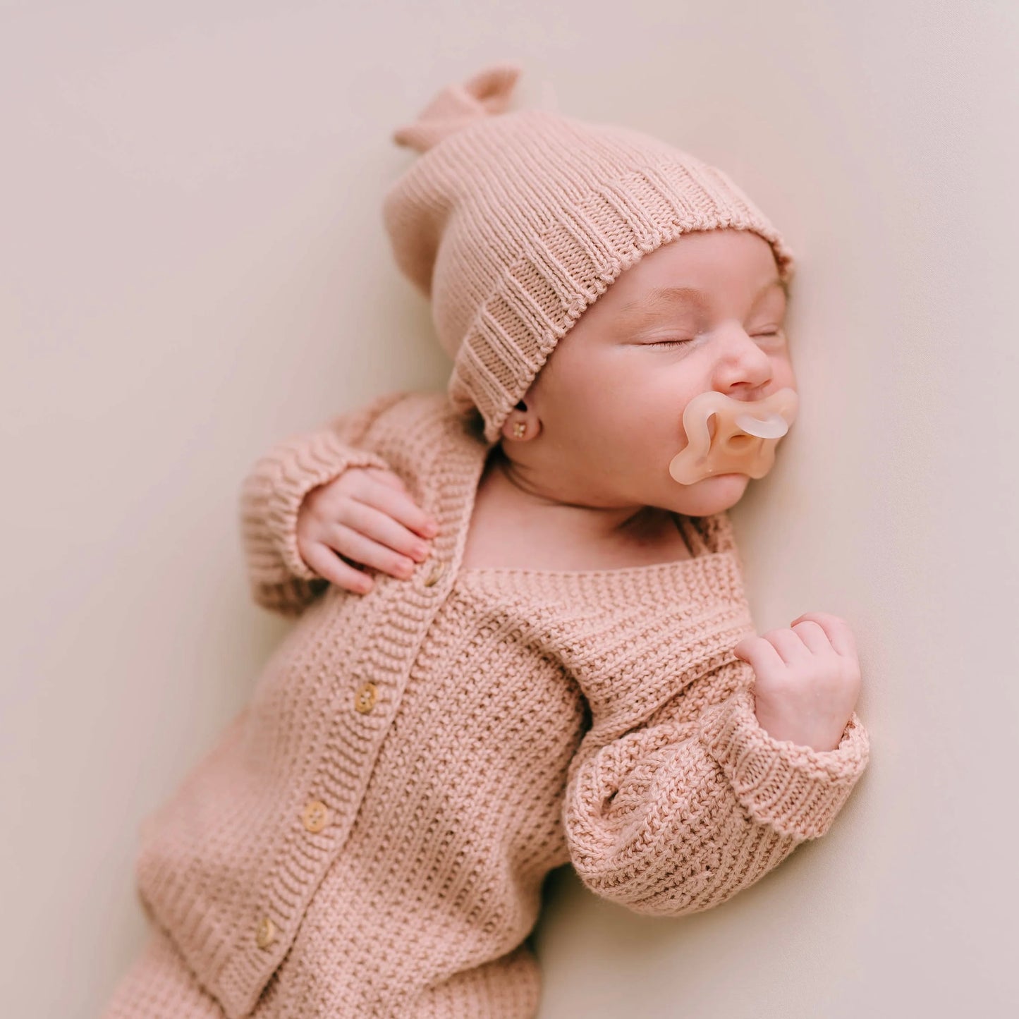 Pink knitted knot hat